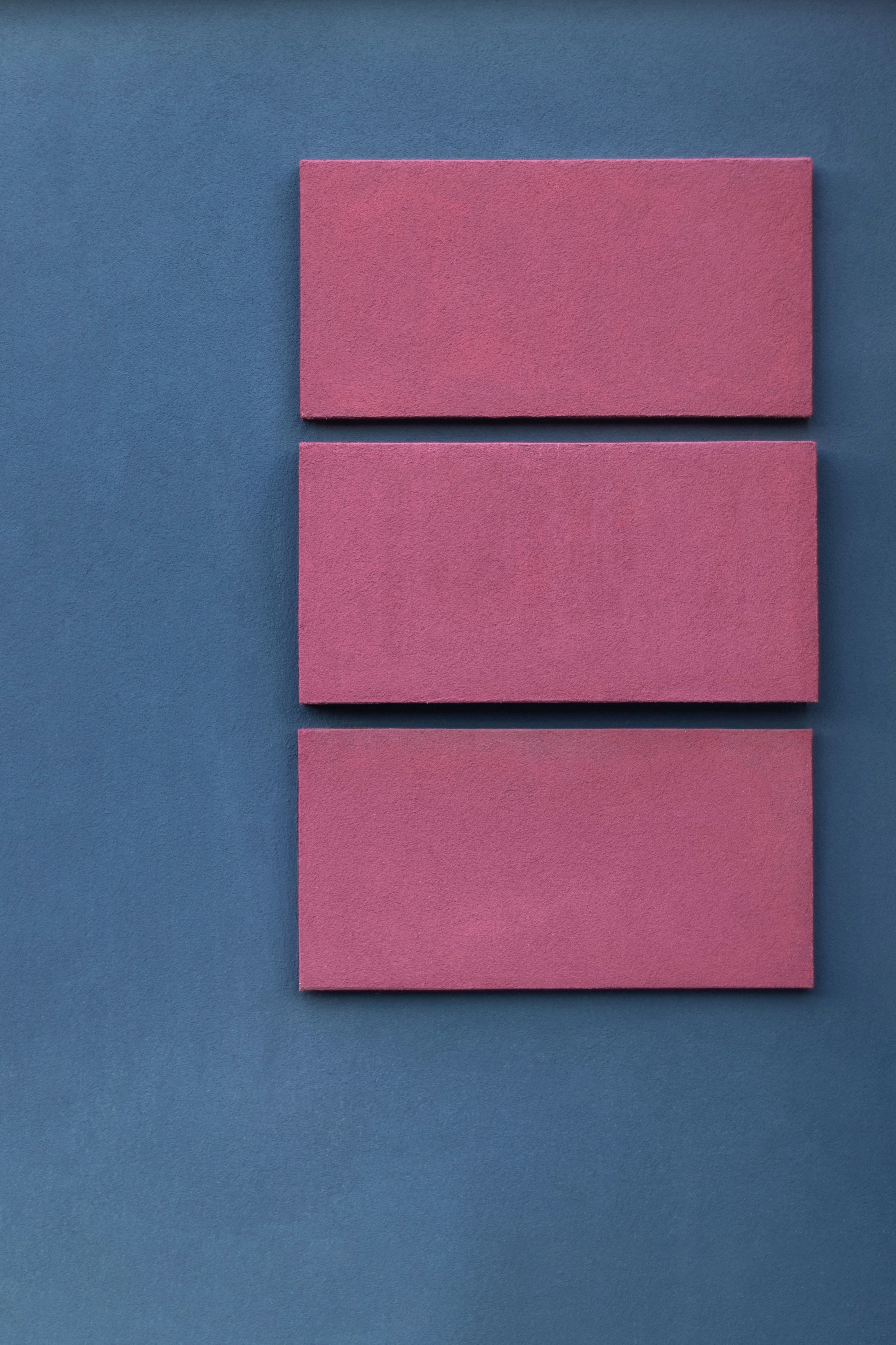 pink boards on blue surface